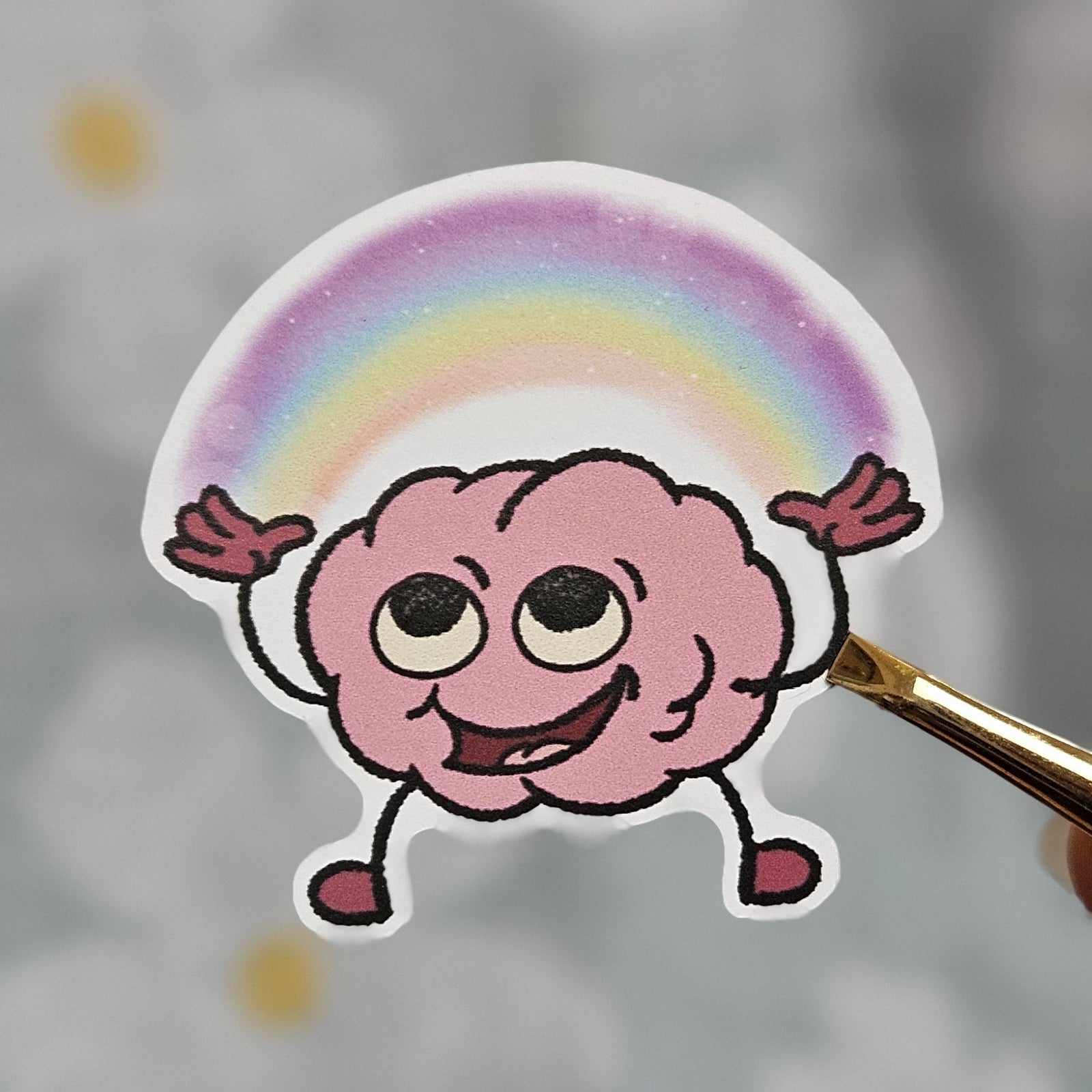 Sticker illustré d'un cerveau aux couleurs de l'arc-en-ciel