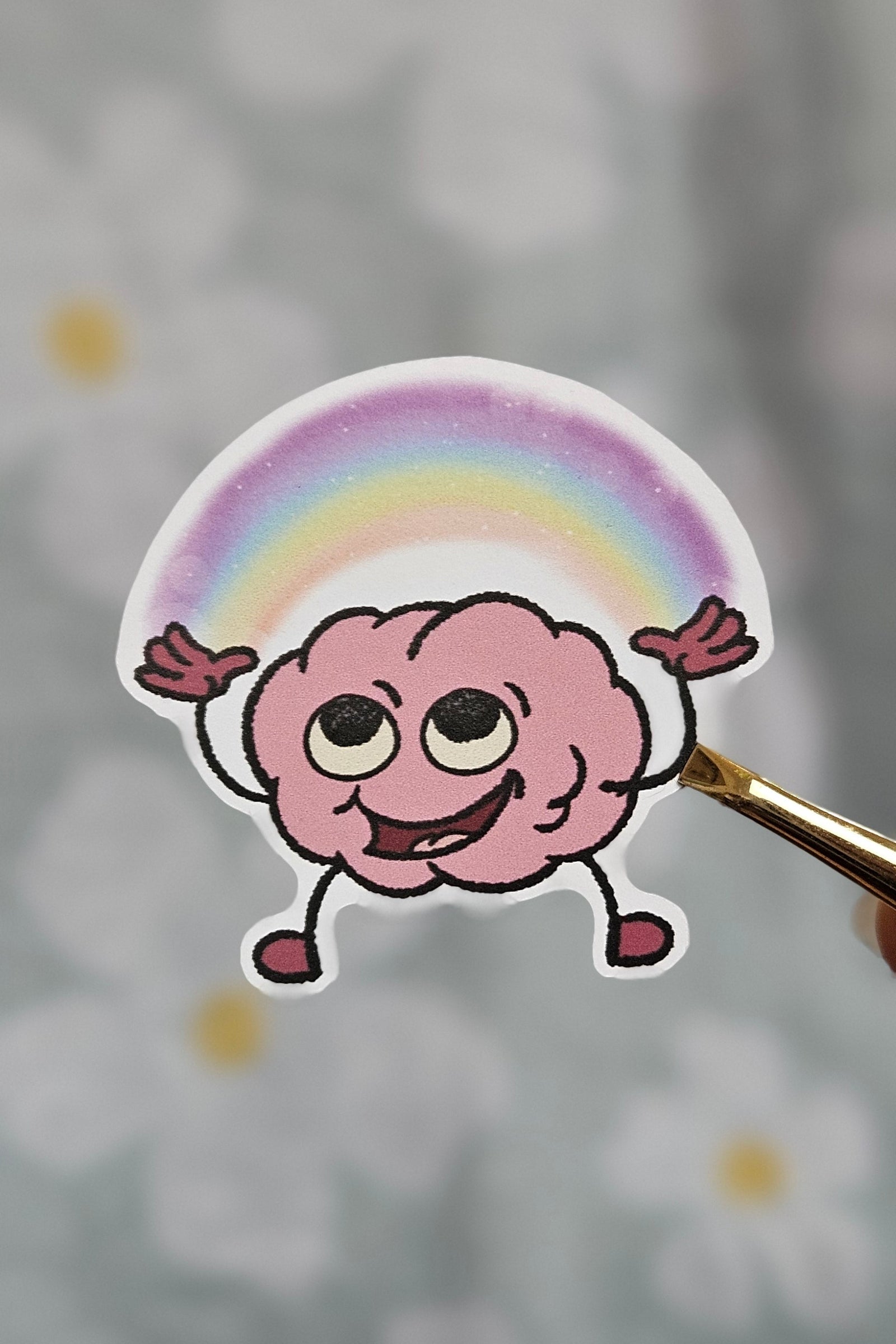 Sticker illustré d'un cerveau aux couleurs de l'arc-en-ciel