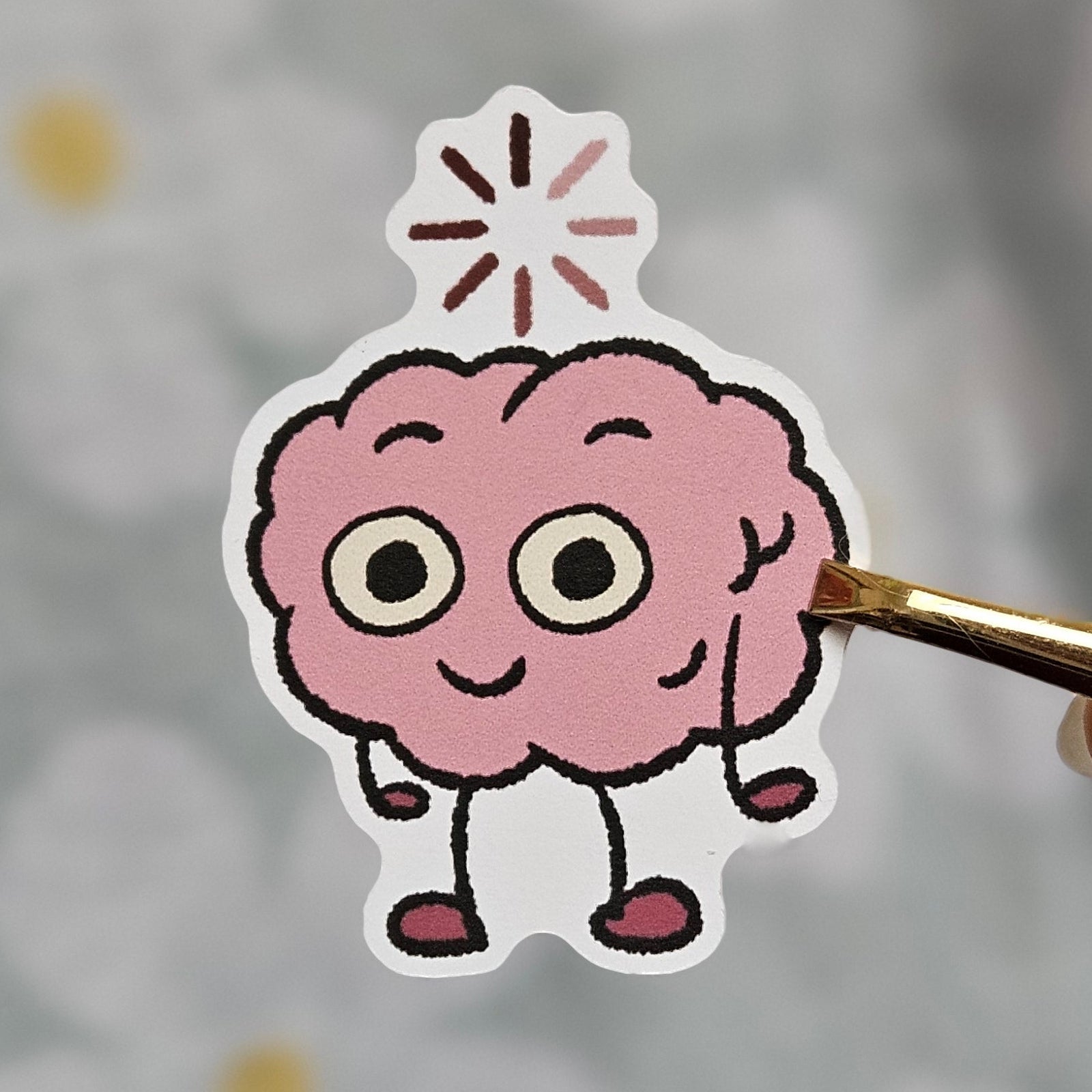 Sticker illustré représentant un cerveau kawaii en train de charger