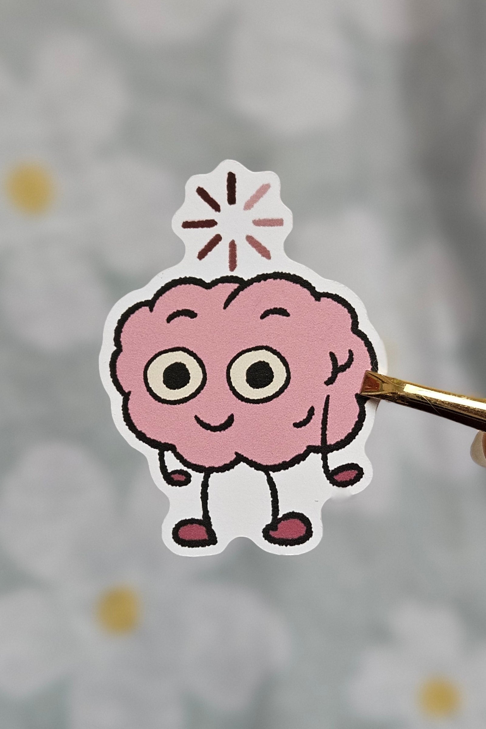 Sticker illustré représentant un cerveau kawaii en train de charger